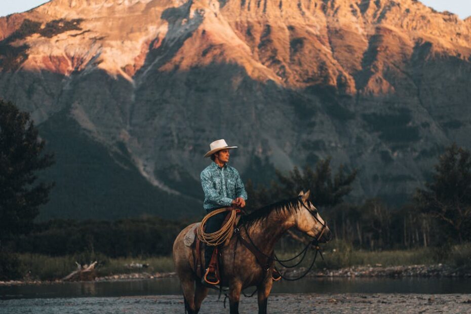 Cowboy riding a Horse on the River in montana